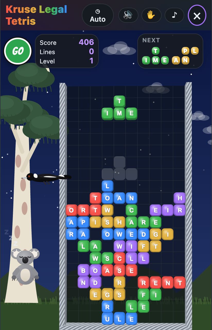 Kruse Legal Tetris at night, the well of coloured blocks with a letter on each, a gum tree, a koala and a magpie beside it